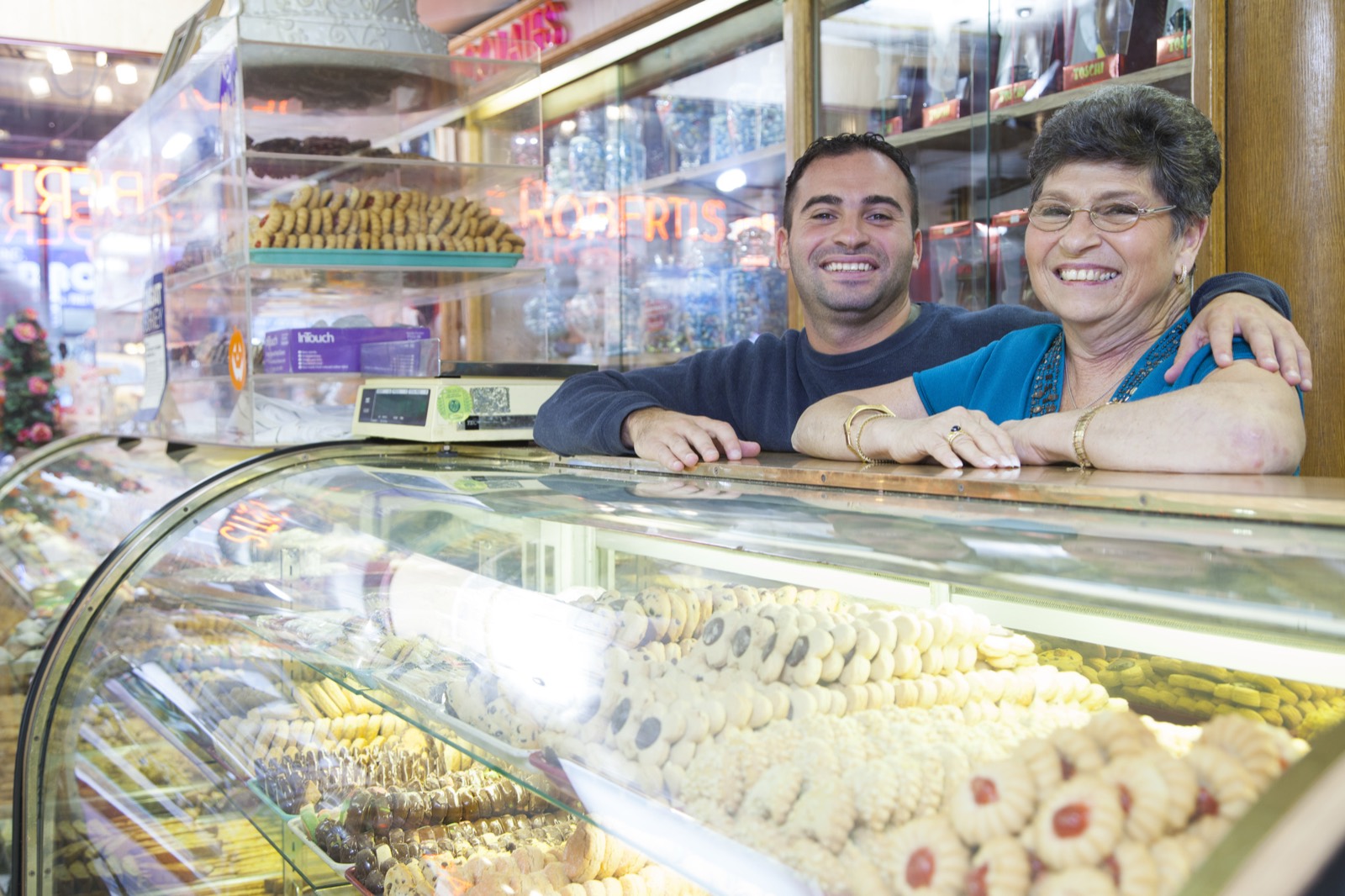 Local small-business owners behind their shop counter